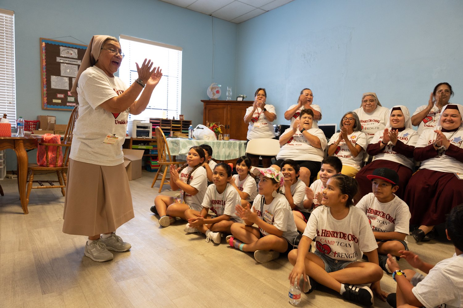 Teresian Sister Dolores Aviles speaks to children attending Camp I-CAN in Uvalde, Texas, July 25. Sponsored by Catholic Extension, the July 25-28 camp offered survivors of the Robb Elementary School mass shooting a safe space to heal, have fun and gently reintegrate into a school-like setting around their peers. “I-CAN” stands for inner strength, commitment, awareness and networking.