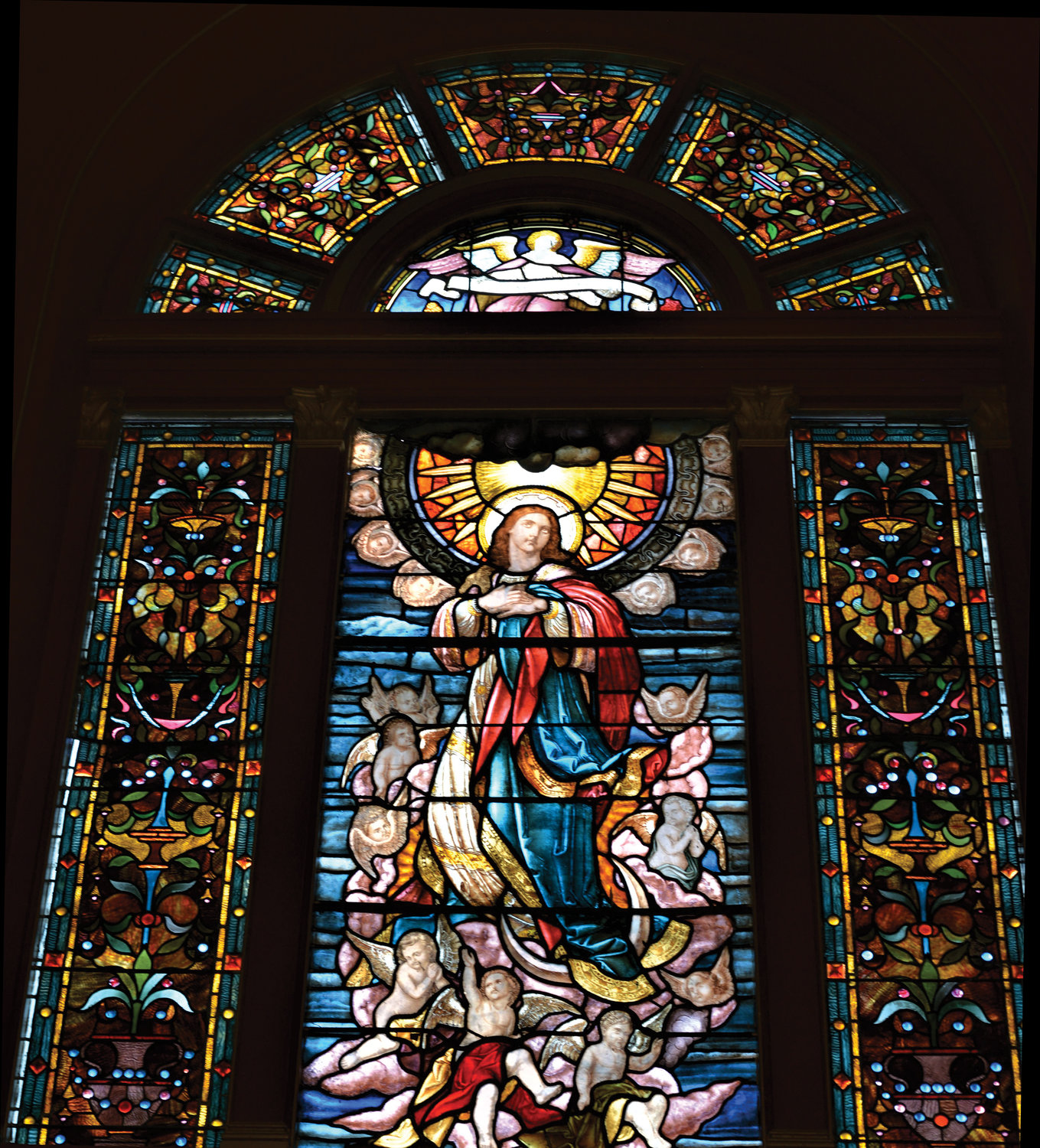 A magnificent stained-glass window is pictured in St. Mary’s Church on Grand Street in Lower Manhattan. The church was one of more than 80 houses of worship in New York state to participate in the Sacred Sites Open House presented by the New York Landmarks Conservancy July 23-24.
