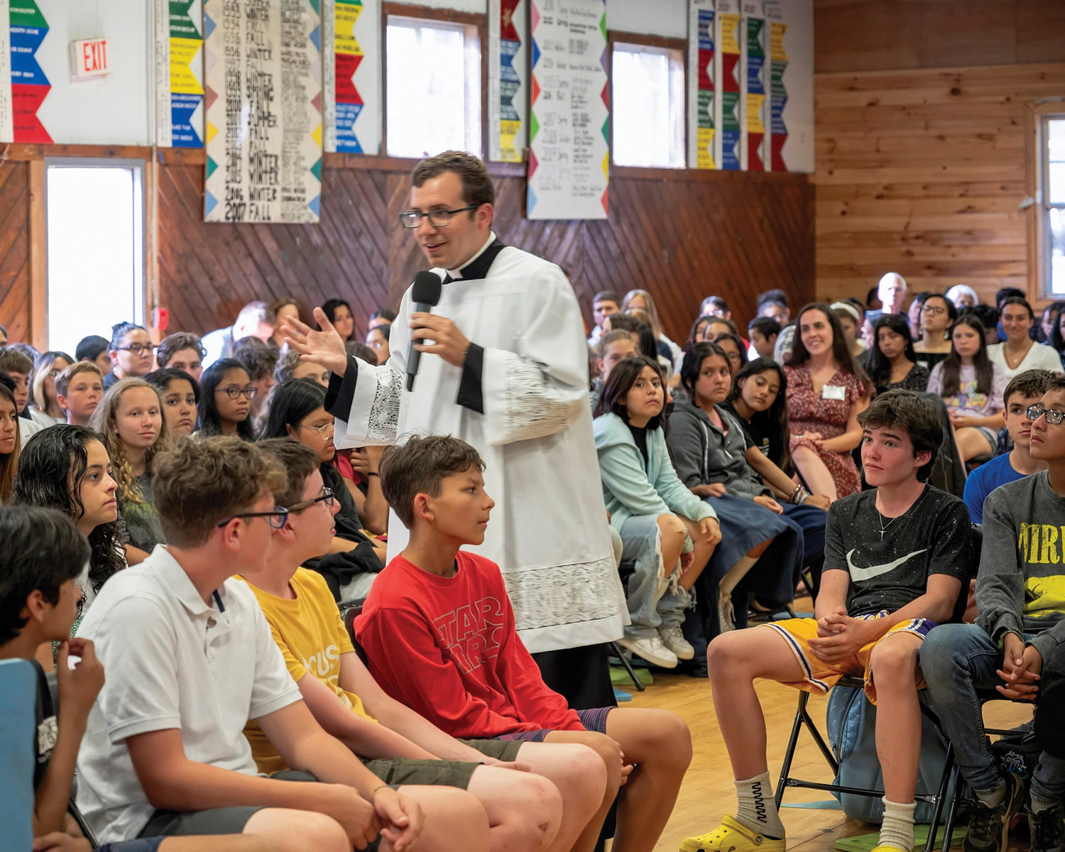 Joseph Haas, a seminarian at St. Joseph’s Seminary in Dunwoodie and a parishioner of St. Mary’s in Washingtonville, speaks to campers and staff before the start of Mass.