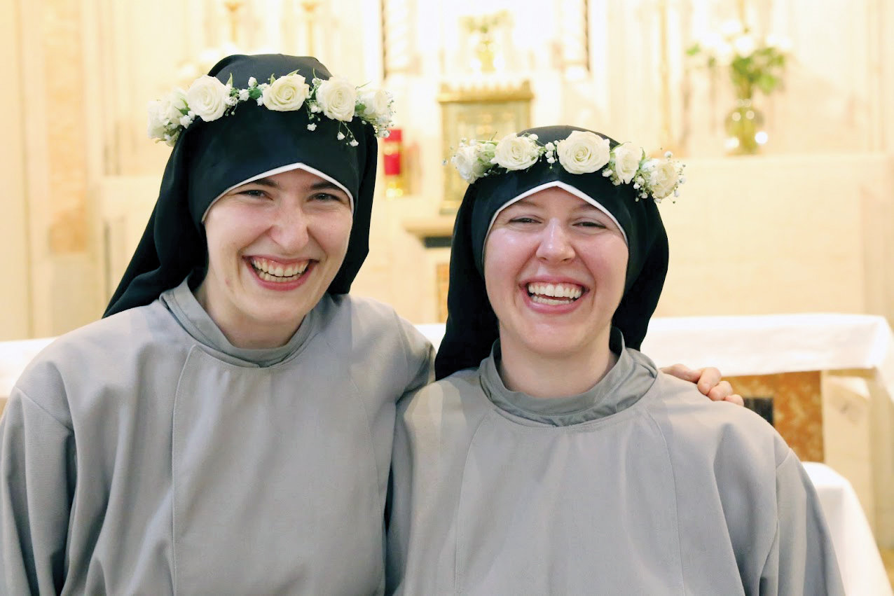 Sister Fidelis and Sister Solanus Mary Payne, C.F.R., beam after professing their vows.