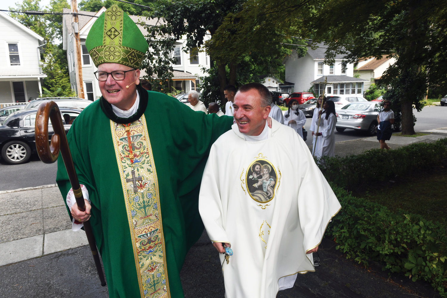 Cardinal Dolan and Father Miroslaw Pawlaczyk, pastor of Immaculate Conception parish in Kingston, walk to a reception following Sept. 4 Mass for the 125th anniversary of the parish church and the 25th anniversary of the adjacent Divine Mercy Perpetual Adoration Chapel.