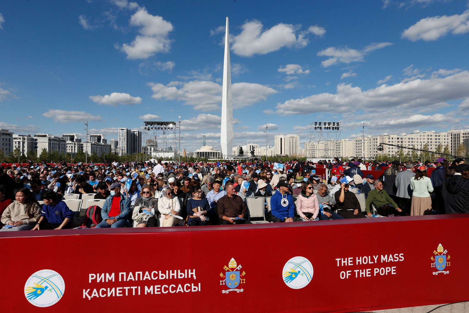 People wait for the start of Pope Francis' Mass at the Expo grounds in Nur-Sultan, Kazakhstan, Sept. 14.