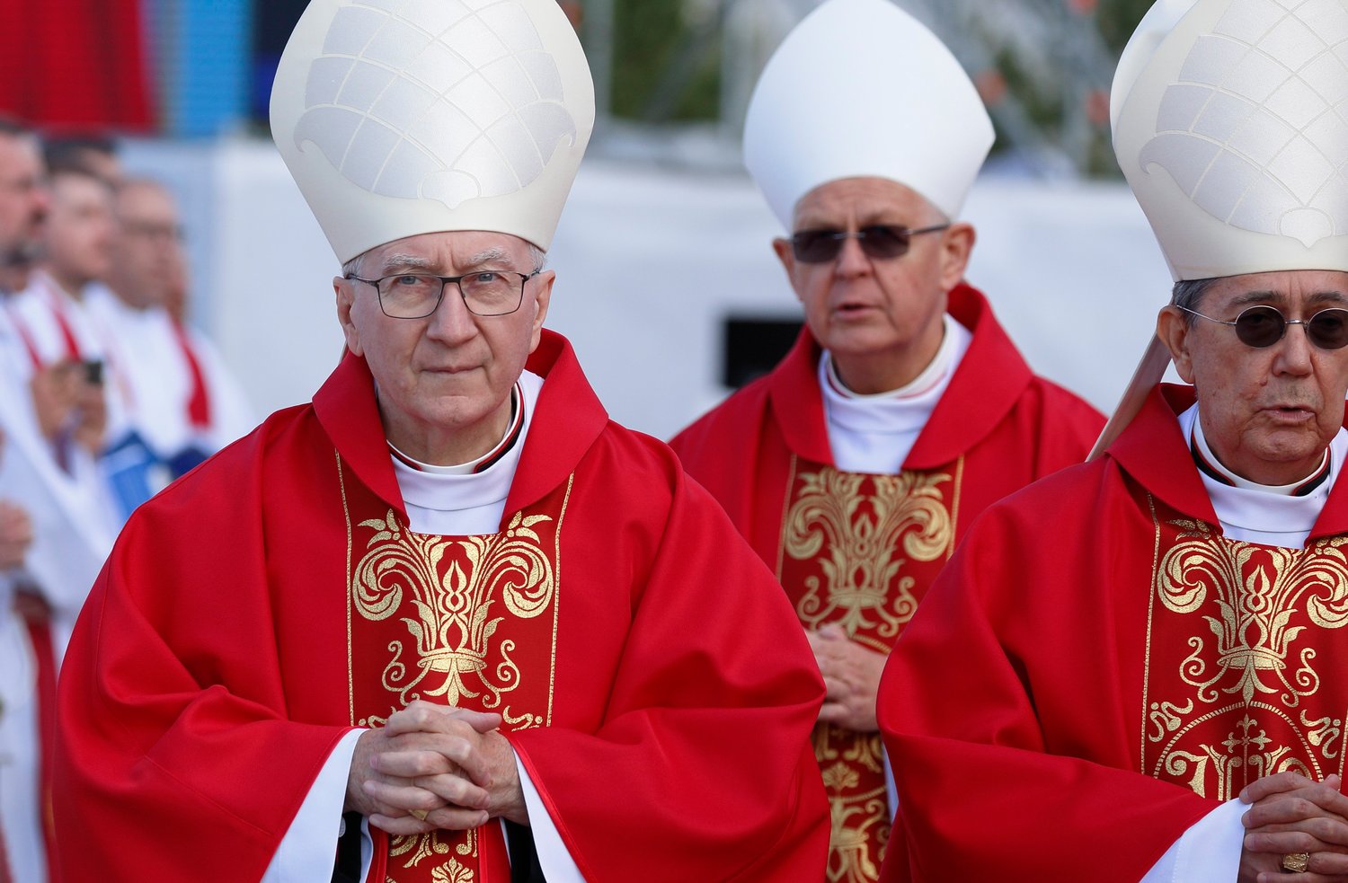 Cardinal Pietro Parolin, Vatican secretary of state, left, and Cardinal Miguel Angel Ayuso Guixot, president of the Dicastery for Interreligious Dialogue, right, arrive in procession for Pope Francis’ Mass at the Expo grounds in Nur-Sultan, Kazakhstan, Sept. 14.