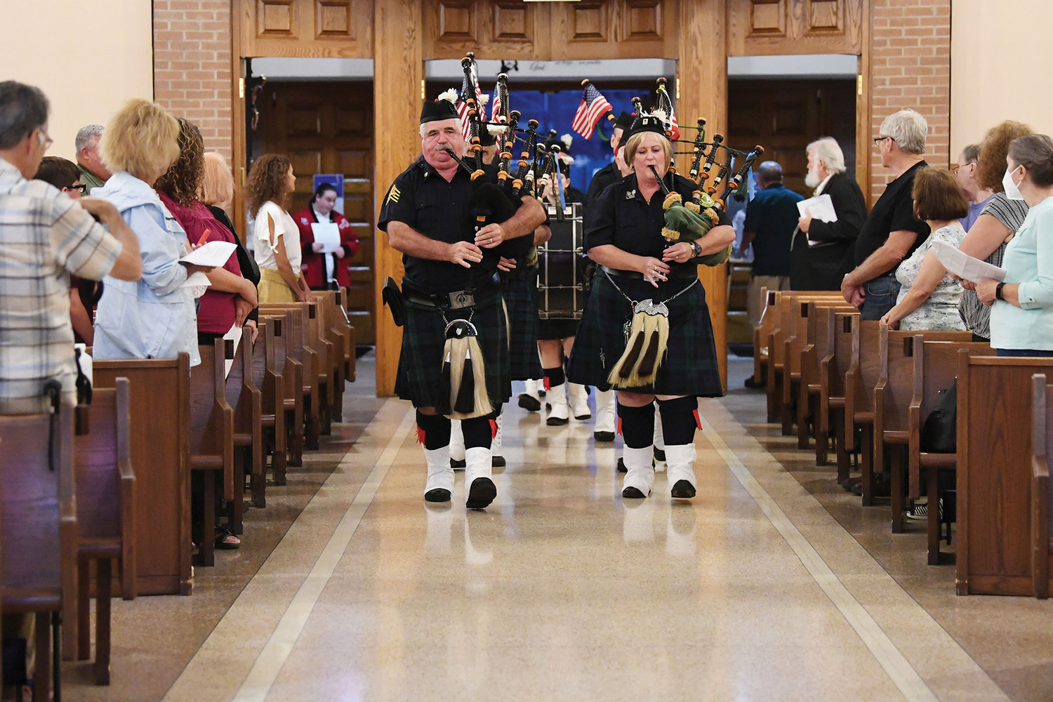 Staten Island Pipers Pipes and Drums lead the procession into Our Lady of Pity.