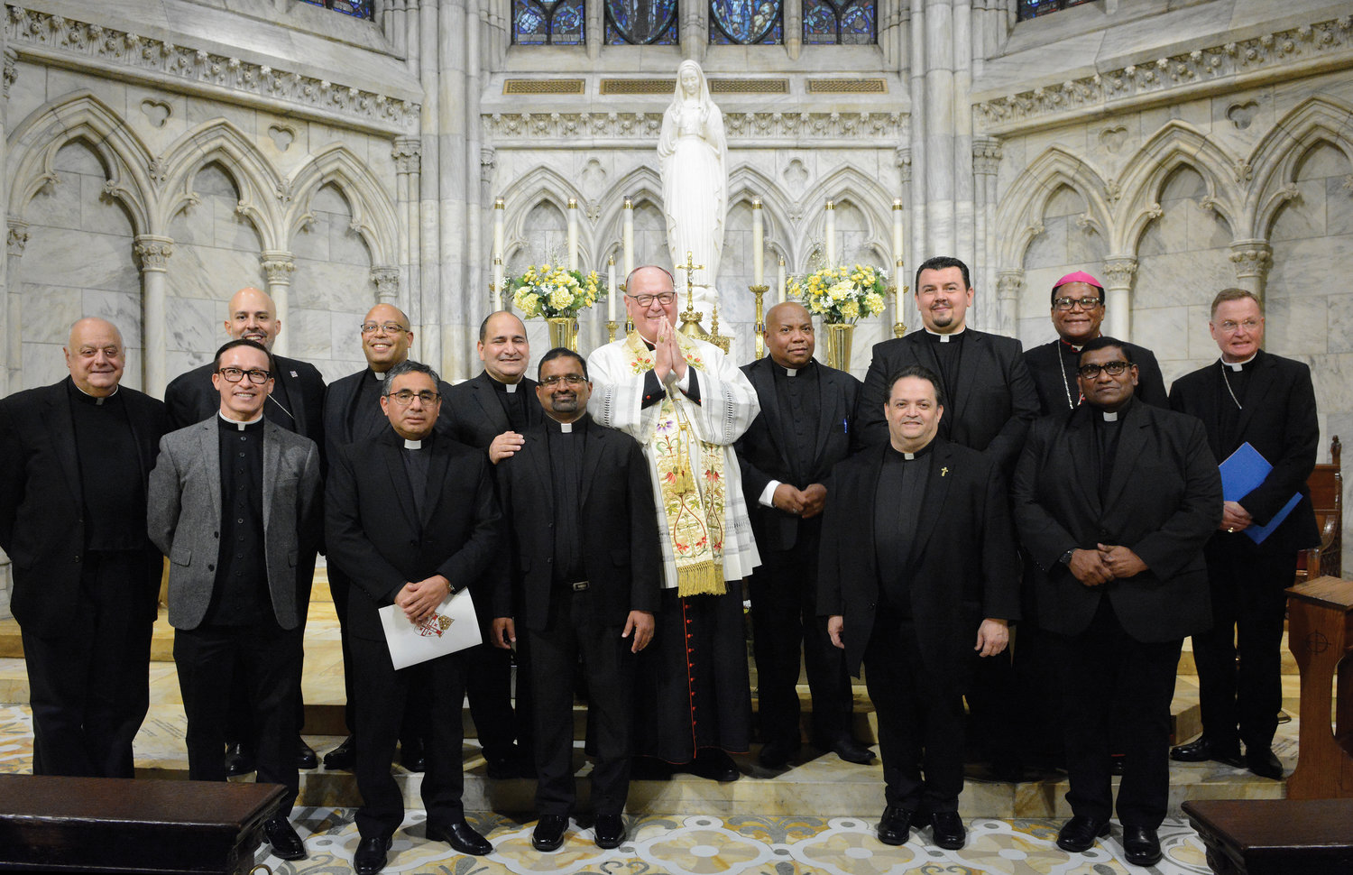 Nine newly incardinated priests of the Archdiocese of New York join Cardinal Dolan and other prelates Sept. 28 in the Lady Chapel of St. Patrick’s Cathedral. Above right are, front row, from left: Msgr. Joseph LaMorte, vicar general; Father Angel Jimenez; Father Bladi Jesus Socualaya-Miranda; Father John Edison Lourdhusamy; Father Randall Soto and Father Conganige Anthony. Back row, from left: Auxiliary Bishop Joseph Espaillat; Father Jorge Cleto; Father Nelson Pichardo; Cardinal Dolan; Father Cyprien Emile; Father Ivan Lovric; Bishop Pierre-André Dumas of Anse-á-Veau and Miragoane, Haiti; and Auxiliary Bishop Edmund Whalen.