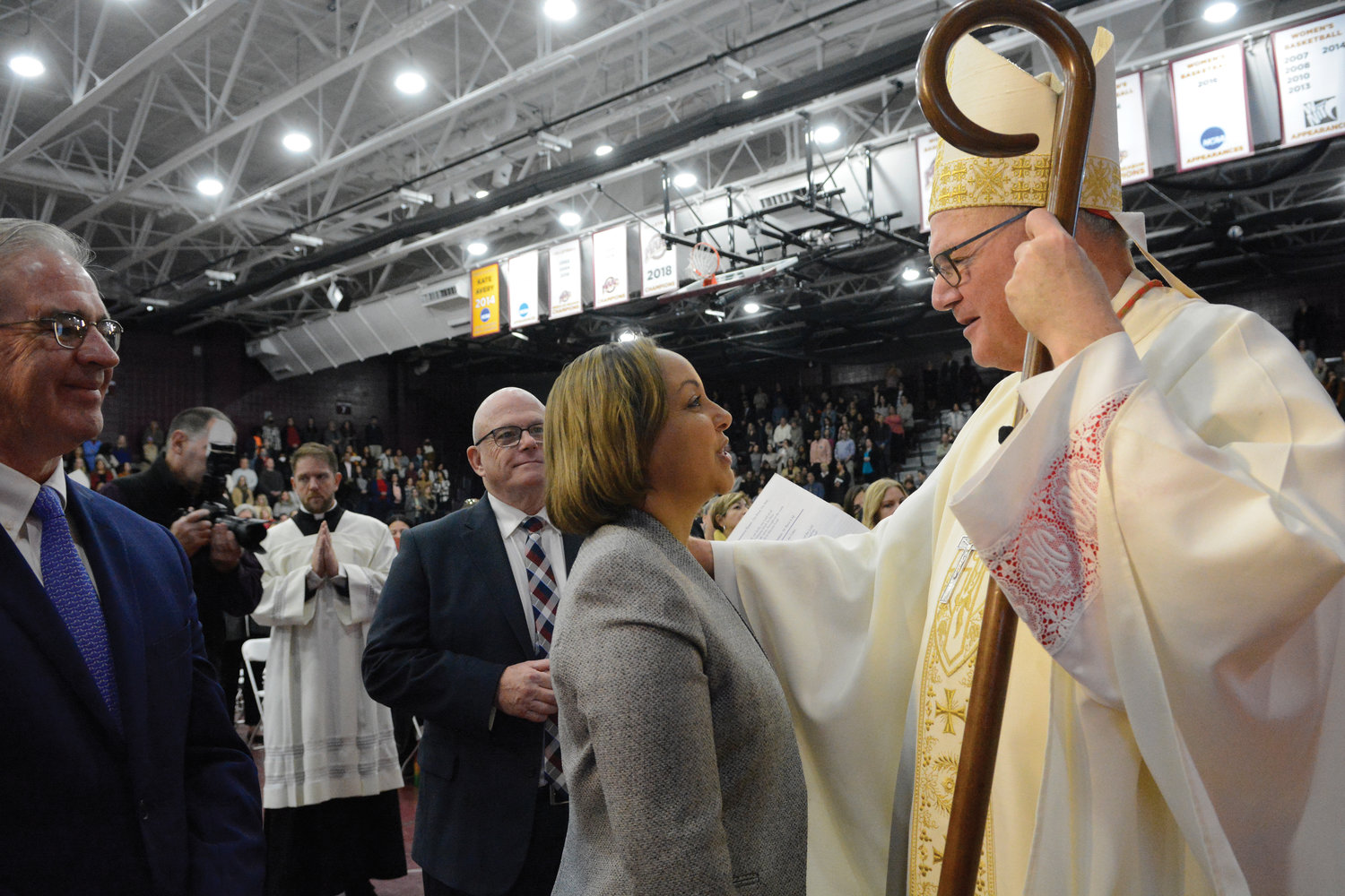 Cardinal Dolan greets Dr. Rae Nell Houston, superintendent of schools for the Archdiocese of New Orleans, at Spirituality Day for Catholic teachers and administrators in the archdiocese at the Hynes Athletic Center at Iona University Oct. 20.