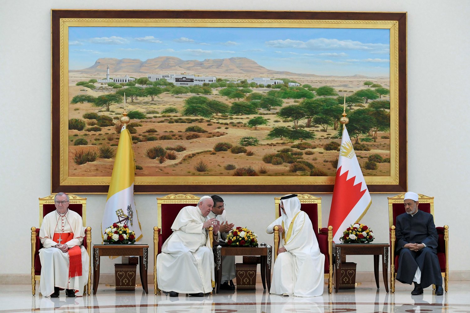 Pope Francis and Bahrain’s King Hamad bin Isa Al Khalifa speak at a farewell ceremony for the pope Nov. 6 at Sakhir air base in Awali. Also pictured is Cardinal Pietro Parolin, Vatican secretary of state, and Sheikh Ahmad el-Tayeb, grand imam of Egypt’s Al-Azhar mosque and university.