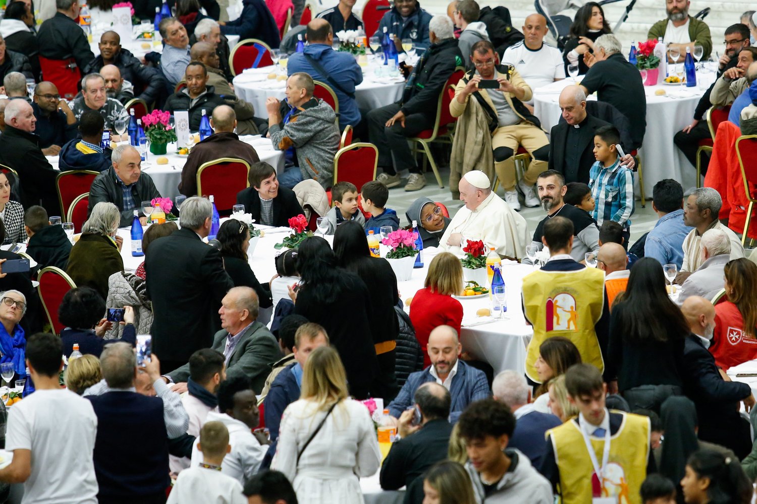 Pope Francis joins some 1,300 guests for lunch in the Vatican audience hall on the World Day of the Poor Nov. 13.
