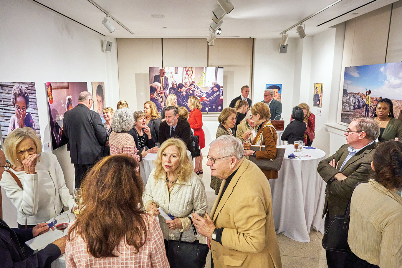 A crowd at the Sheen Center for Thought & Culture in Lower Manhattan views the Nov. 1 photo exhibit, “And who is my neighbor? The faces of CNEWA.” Photographers captured the images revealing the innate dignity and beauty of every person while on assignment for Catholic Near East Welfare Association (CNEWA) in the Middle East, Northeast Africa, India and Eastern Europe.