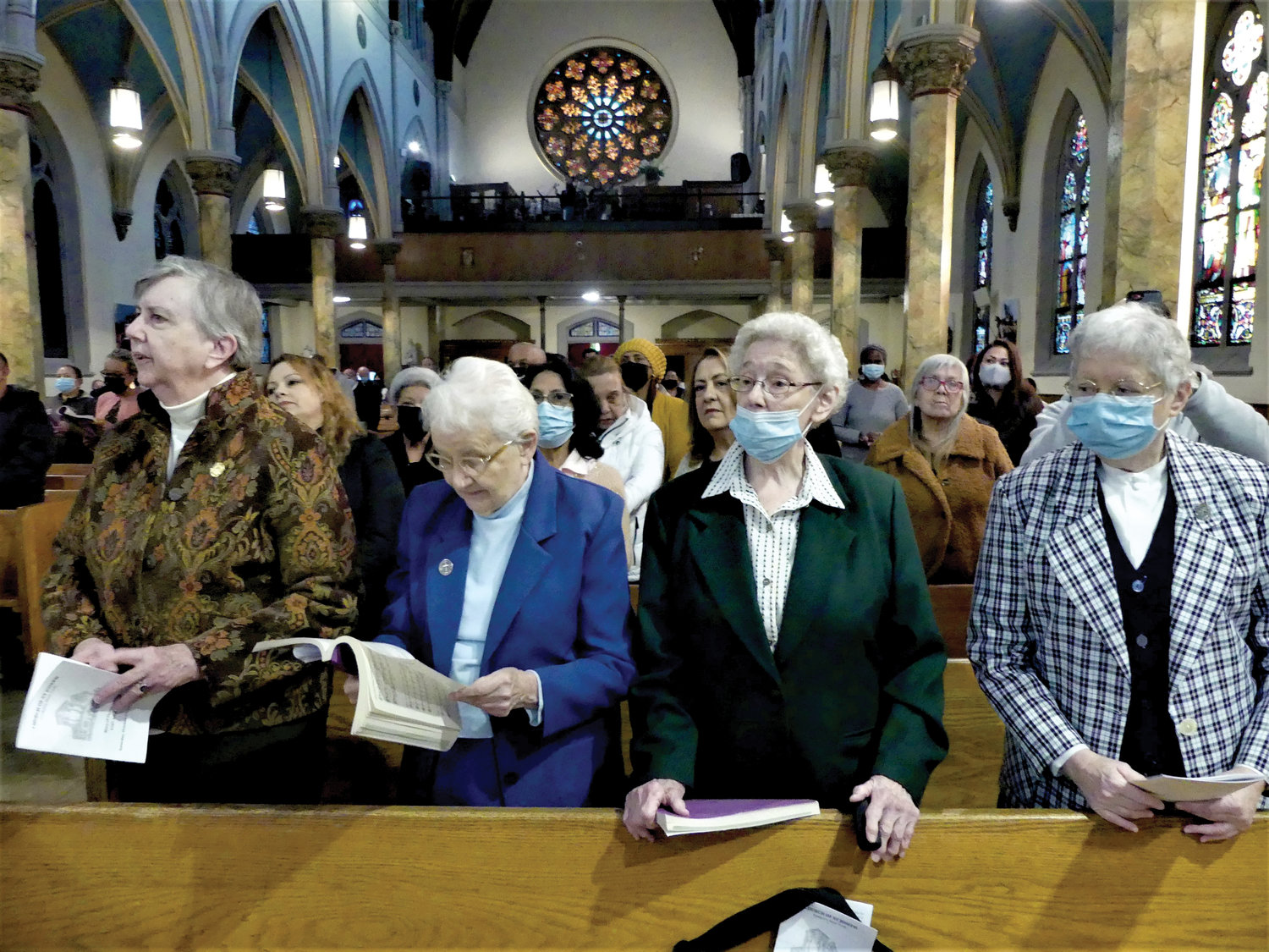 Members of the Sisters of Charity of New York attend Mass at St. Joseph’s where their religious congregation once administered the parish school.