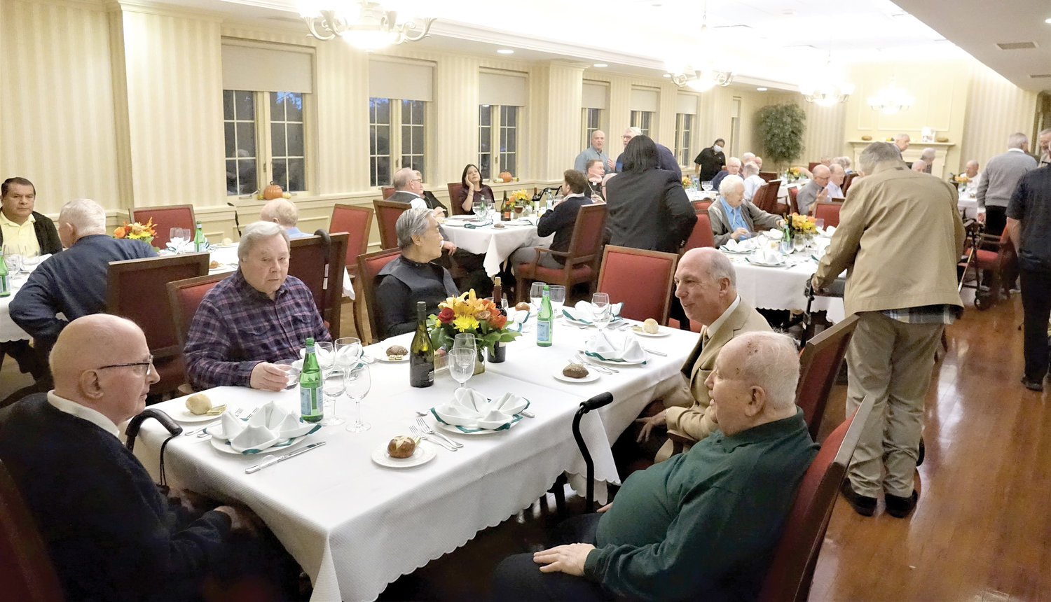 Priests enjoy a convivial evening Oct. 31 during an Oktoberfest celebration at St. John Vianney Clergy Residence in the Riverdale section of the Bronx.